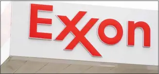  ?? ?? A sign for an Exxon gas station is displayed in Upper Darby, Pa., Tuesday, April 26, 2022. Exxon Mobile reports quarterly financial results on Oct 28. (AP)