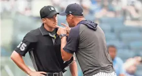  ?? AP ?? New York Yankees manager Aaron Boone yells at home plate umpire Brennan Miller during the second inning against Tampa Bay on Tuesday night.