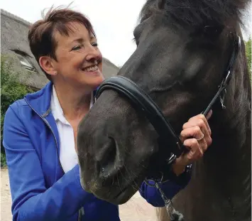  ?? ALEKSANDAR FURTULA/AP PHOTOS ?? Els van der Heijden, a cystic fibrosis patient, stands with her Icelandic horse in Hekendorp, Netherland­s in June, 2017. Her condition improved with the help of tests done on mini organs generated from her own cells.