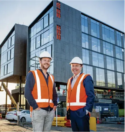  ??  ?? Ryan Wilson, founder and chief executive of Generator (left), and Brett O'Riley, chief executive of ATEED, standing outside the soon-to-be completed Madden St. building.