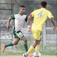  ?? (Pic: Mengameli Mabuza) ?? Ezulwini United’s Mphucuko ‘Smothies’ Dlamini (L) being challenged by Ludzeludze Killers’ Mncedisi Dlamini during their MTN National First Division game at Manzini Club yesterday. The game finished in a 2-all draw.