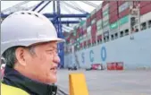  ?? XINHUA ?? Fu Chengqiu, president of Piraeus Container Terminal SA, inspects operations at Piraeus port in Athens, Greece, on Monday.