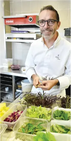  ?? AFP/GETTY IMAGES ?? French chef Sebastien Bras poses as he works in the kitchen of his threestar restaurant Le Suquet, in Laguiole, southern France, on Thursday, after announcing that he asked not to be included in the Michelin Guide starting in 2018. Sebastien Bras, chef...