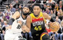  ?? —USA TODAY SPORTS ?? Donovan Mitchell (right) hits the ground running in his return, missing just two shots from the field.