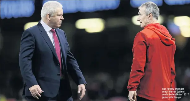  ??  ?? Rob Howley and head coach Warren Gatland confer before Wales’ 2017 game with Georgia