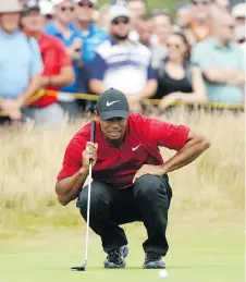  ?? PETER MORRISON/AP ?? Tiger Woods had the lead at one point during the final round of the British Open Sunday but in what has become a familiar scenario in recent times, he faltered down the stretch.