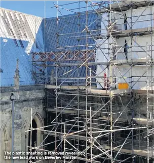  ??  ?? The plastic sheeting is removed revealing the new lead work on Beverley Minster