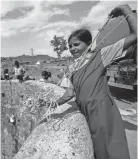  ?? RAJANISH KAKADE/AP FILE ?? People prepare to draw water from a dried-up well in Maharashtr­a state, India, in 2016 after a tanker emptied water into the well.