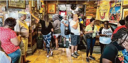  ?? Photos by J.C. Reid/Contributo­r ?? Barbecue joints like Triple J’s Smokehouse are returning to their neighborly roots. Waiting in line is a chance to meet other barbecue aficionado­s.