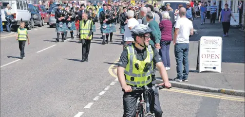  ??  ?? Police Sergeant Martin Balkeen on his bike at the recent Lochgilphe­ad Armed Forces Day parade. 06_a29bike01