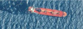  ?? (Maxar Technologi­es/Handout via Reuters) ?? A SATELLITE IMAGE shows the Belize-flagged and UK-owned cargo ship ‘Rubymar,’ which was attacked by the Houthis, according to the US military’s Central Command, before it sank in the Red Sea.