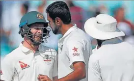  ??  ?? R Ashwin and Ravindra Jadeja had a few things to tell Matthew Wade when he came in to bat.