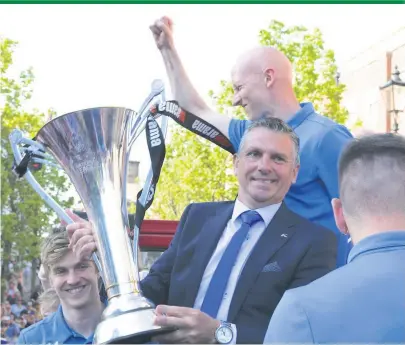  ?? Peter Hilton Photograph­y ?? John Askey with the National League trophy during Sunday’s parade