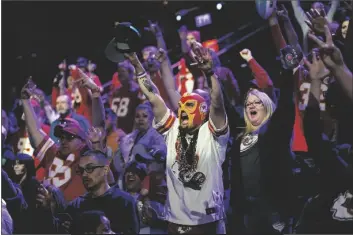  ?? MATT YORK/AP ?? KANSAS CITY CHIEFS FANS CHEER during the NFL football Super Bowl 57 opening night on Monday in Phoenix. The Kansas City Chiefs will play the Philadelph­ia Eagles on Sunday.