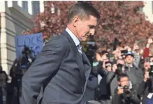  ?? SUSAN WALSH/AP ?? Former National Security Adviser Michael Flynn leaves federal court in Washington, D.C., after pleading guilty to making false statements to the FBI.