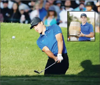  ??  ?? Cameron Champ chips the ball onto the 18th green of the Silverado Resort North Course during the final round of the Safeway Open PGA golf tournament. (Inset): Cameron Champ poses with his trophy on the 18th green of the Silverado Resort North Course after winning the Safeway Open PGA golf tournament on Sept 29, 2019 in Napa,
California. (AP)