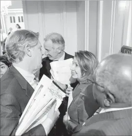  ?? J. Scott Applewhite Associated Press ?? DEMOCRATS Nancy Pelosi, the House minority leader, center, and Rep. Frank Pallone, left, voiced opposition to the easing of limits on TV station ownership.