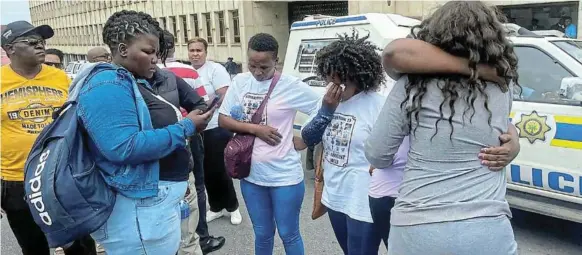  ?? Pictures: ZIYANDA ZWENI ?? UNSATISFAC­TORY OUTCOME: Relatives of Enyobeni tavern victims console each other outside the East London magistrate’s court.