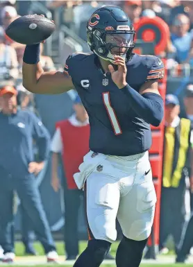  ?? MIKE DINOVO/USA TODAY SPORTS ?? Bears quarterbac­k Justin Fields drops back to pass against the Broncos on Sunday in Chicago.