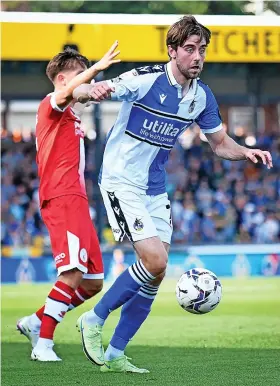  ??  ?? Rovers debutant Antony Evans shields the ball in Saturday’s game