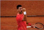  ?? AP PHOTO/JEAN-FRANCOIS BADIAS ?? Serbia’s Novak Djokovic celebrates winning his quarterfin­al match of the French Open tennis tournament against Russia’s Karen Khachanov in four sets, 4-6, 7-6 (7-0), 6-2, 6-4, at the Roland Garros stadium in Paris, Tuesday, June 6, 2023.