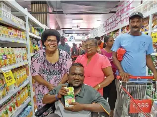  ?? . Photo: Nicolette Chambers ?? Customers, Makereta Vatuloka, Jainendra Sami and Parschilla Devi shopping at the newlyopene­d CJS Supermarke­t in Lautoka on December 1, 2022