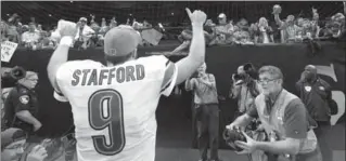  ?? BUTCH DILL, THE ASSOCIATED PRESS ?? Detroit’s Matthew Stafford gives fans thumbs up after beating the Saints in New Orleans. The Lions won, 28-13. The Lions also became the first team in 60 Saints home games to stop Drew Brees from completing a TD pass.