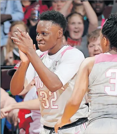  ?? [BARBARA J. PERENIC/DISPATCH] ?? Shayla Cooper of the Ohio State celebrates a trip to the line after being fouled. Cooper had 20 points and nine rebounds.