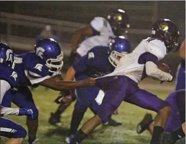  ?? Terrance Armstard/News-Times ?? Jersey tug: Junction City running back Jakiron Cook tries to break free from a Parkers Chapel defender during their 8-2A contest at Victor Nipper Stadium earlier this season. Junction City takes on Foreman in the 2A state semifinals Friday night.