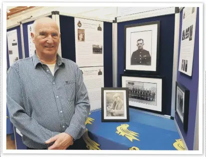  ?? ?? Alan Moore with informatio­n about his grandparen­ts, Frederick and Ethel Hoare, at his West Sussex Contabular­y exhibition in Chichester. The main picture in the centre is Frederick, a Worthing policeman for many years, and the picture in the standing frame is from a story in the Worthing Herald about the day he rescued a pigeon from the post office.