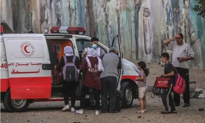  ??  ?? ‘Isn’t it time for the whole world to open their eyes to what is going on in the Gaza Strip’ A Palestinia­n ambulance evacuates a family after airstrikes on Gaza City. Photograph: Mohammed Saber/EPA