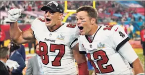  ?? Ashley Landis / Associated Press ?? Tampa Bay Buccaneers tight end Rob Gronkowski, left, and quarterbac­k Tom Brady celebrate after defeating the Kansas City Chiefs in the Super Bowl 55 on Feb. 7 in Tampa, Fla.