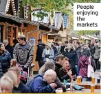  ?? ?? People enjoying the markets