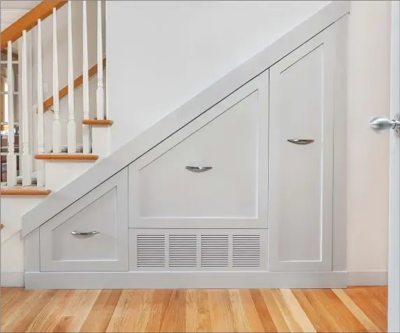  ??  ?? Transform the overlooked area under the staircase into storage space.