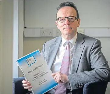  ??  ?? Dr David Strang with a copy of his report into mental health services in Tayside.