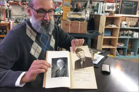  ?? EVAN BRANDT — MEDIANEWS GROUP ?? Pottstown NAACP Chapter President Johnny Corson hold photos of his great grandfathe­r, Simon Corson, and his grandfathe­r David Corson.