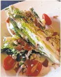  ?? JACKIE BURRELL/STAFF ?? Columbia's City Hotel Restaurant and What Cheer Saloon is the purview of chef Christophe­r Segarini, who has given the menu a fresh, seasonal vibe with dishes such as this baby gem lettuce and gorgonzola take on a classic wedge salad.