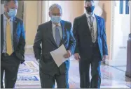  ?? JOSE LUIS MAGANA — THE ASSOCIATED PRESS ?? Senate Majority Leader Mitch McConnell, R-Ky., center, walks to the Senate chamber on Capitol Hill, in Washington, Thursday, Oct. 22.