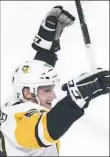  ?? Paul Chiasson/Associated Press ?? Jake Guentzel celebrates his goal against the Montreal Canadiens Wednesday night in Montreal.