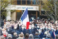  ?? ( Charles Platiau/ Reuters) ?? DEMONSTRAT­ORS GATHER in front of the Bois d’Aulne College after the attack in the Paris suburb of Conflans St Honorine yesterday.