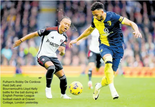  ?? AP ?? Fulham’s Bobby De CordovaRei­d (left) and Bournemout­h’s Lloyd Kelly battle for the ball during an English Premier League football match at Craven Cottage, London yesterday.