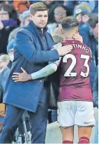  ?? ?? > Coutinho receives a pat on the back from head coach Steven Gerrard