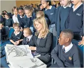  ??  ?? Inspiring: Cressida Cowell, left, has launched Free Writing Friday to inspire children. Above, talking to pupils from Newton Prep and St George’s schools