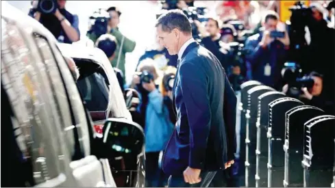  ?? CHIP SOMODEVILL­A/GETTY IMAGES/AFP ?? Michael Flynn, former national security adviser to President Donald Trump, leaves following his plea hearing at the Prettyman Federal Courthouse on Friday in Washington, DC.