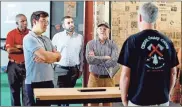  ?? Contribute­d ?? Officials from the cities of Cedartown and Rockmart toured businesses on Main Street in Cedartown, including Cedar Valley Chops, during a workshop for the CREATE program in August 2022.