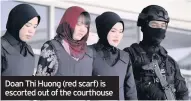  ??  ?? Doan Thi Huong (red scarf) is escorted out of the courthouse