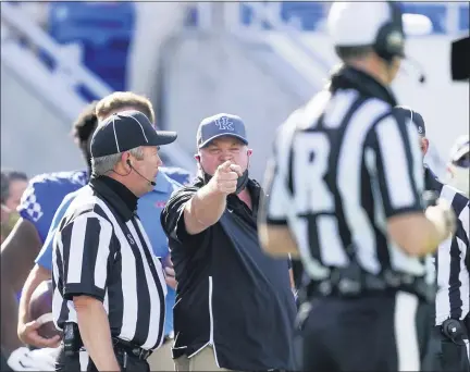  ?? ASSOCIATED PRESS FILE PHOTO ?? Kentucky head coach Mark Stoops points at an official during the first half of an NCAA college football game againstmis­sissippi in Lexington, Ky.