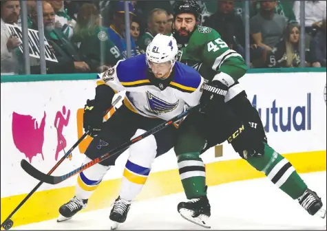  ?? TONY GUTIERREZ/AP ?? Dallas defenceman Roman Polak, right, gets in the way of Tyler Bozak of the St. Louis Blues during this year’s StarsBlues playoff series. Polak is the sandpaper to defence partner Miro Heiskanen’s skill.