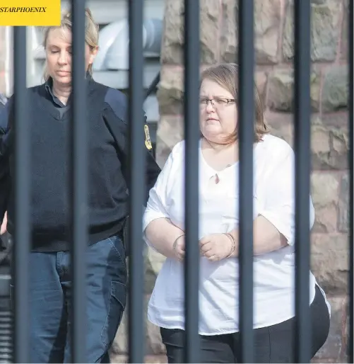  ?? PETER POWER / THE CANADIAN PRESS ?? Elizabeth Wettlaufer is escorted from a courthouse in Woodstock, Ont., after pleading guilty to eight counts of first-degree murder.