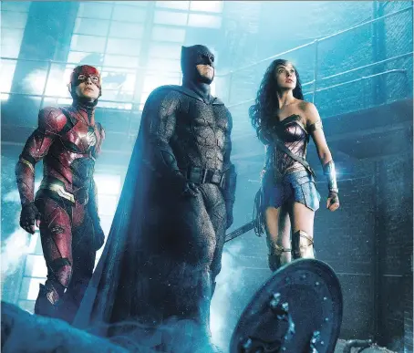  ?? WARNER BROS. ?? Ezra Miller, left, Ben Affleck and star Gal Gadot star in Justice League. Its high-def picture may be clear, but the movie, not so much.